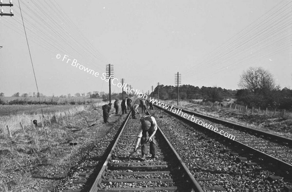 MEN WORKING ON RAILWAY LINE